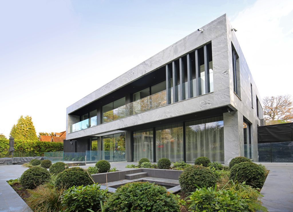 Selbourne House exterior with lightweight stone cladding panels and landscaped garden.