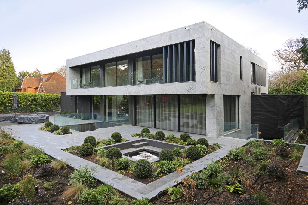 Selbourne House exterior with lightweight stone cladding panels and landscaped garden.